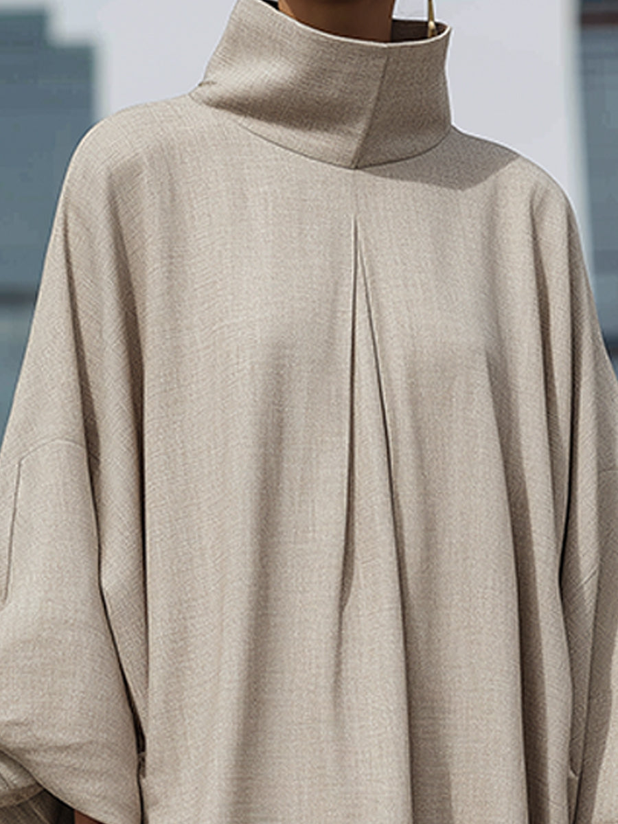 Elegantna maxi obleka s visokim ovratnikom in kokonsko silhueto