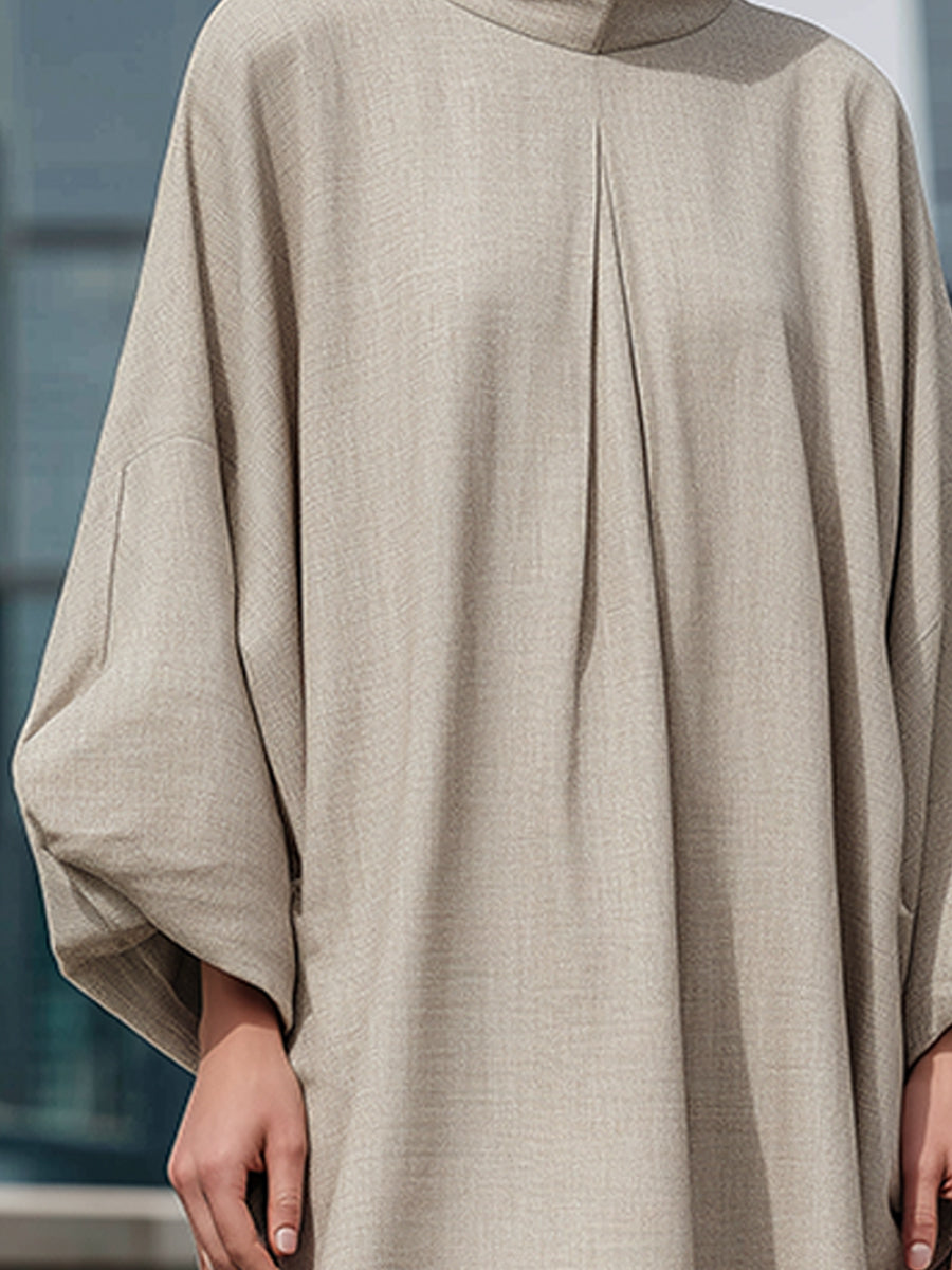 Elegantna maxi obleka s visokim ovratnikom in kokonsko silhueto