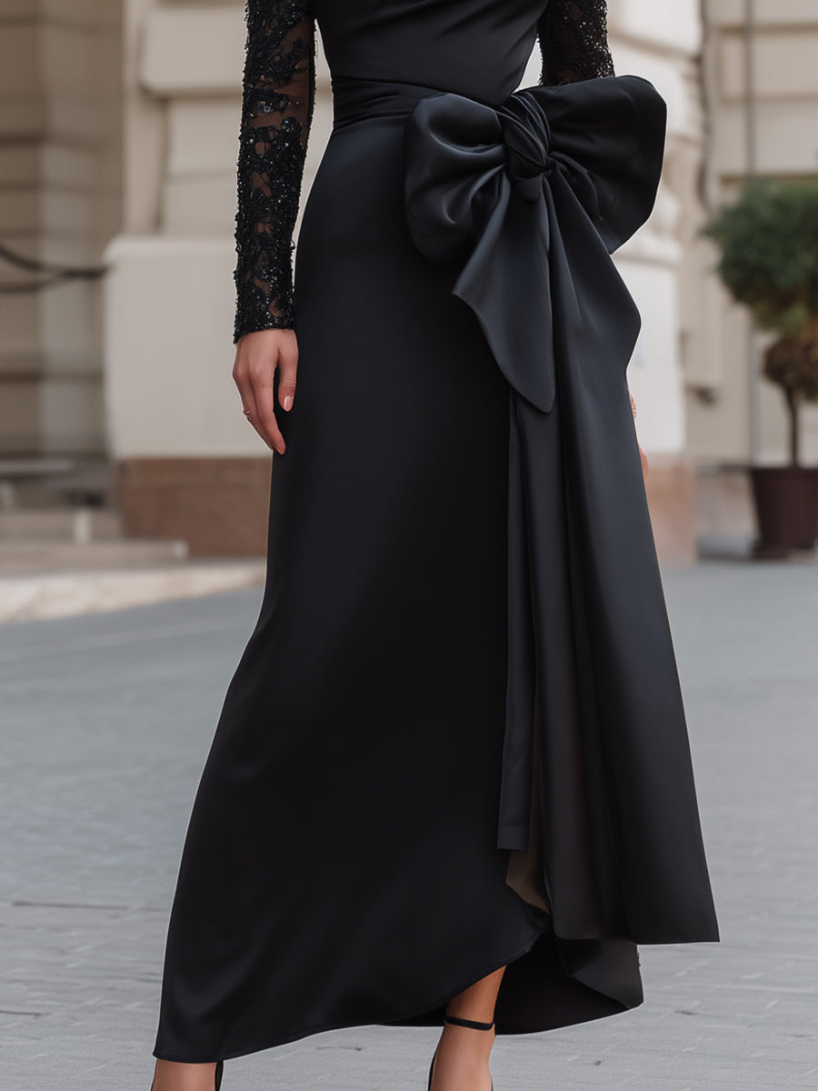 Asimetrična obleka z odprtimi rameni, okrašena s čipko in satenastim trakom