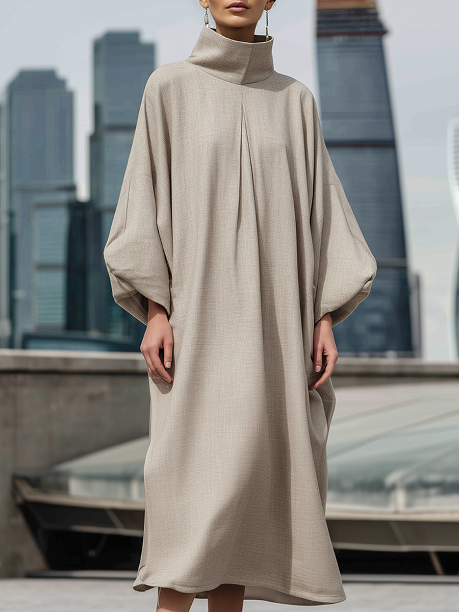 Eleganten maxi obleka s kokonsko silhueto in visokim ovratnikom